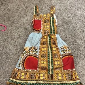 Boutique cotton sun dress. Mixed print. Vibrant colors. Knot/bow tie back